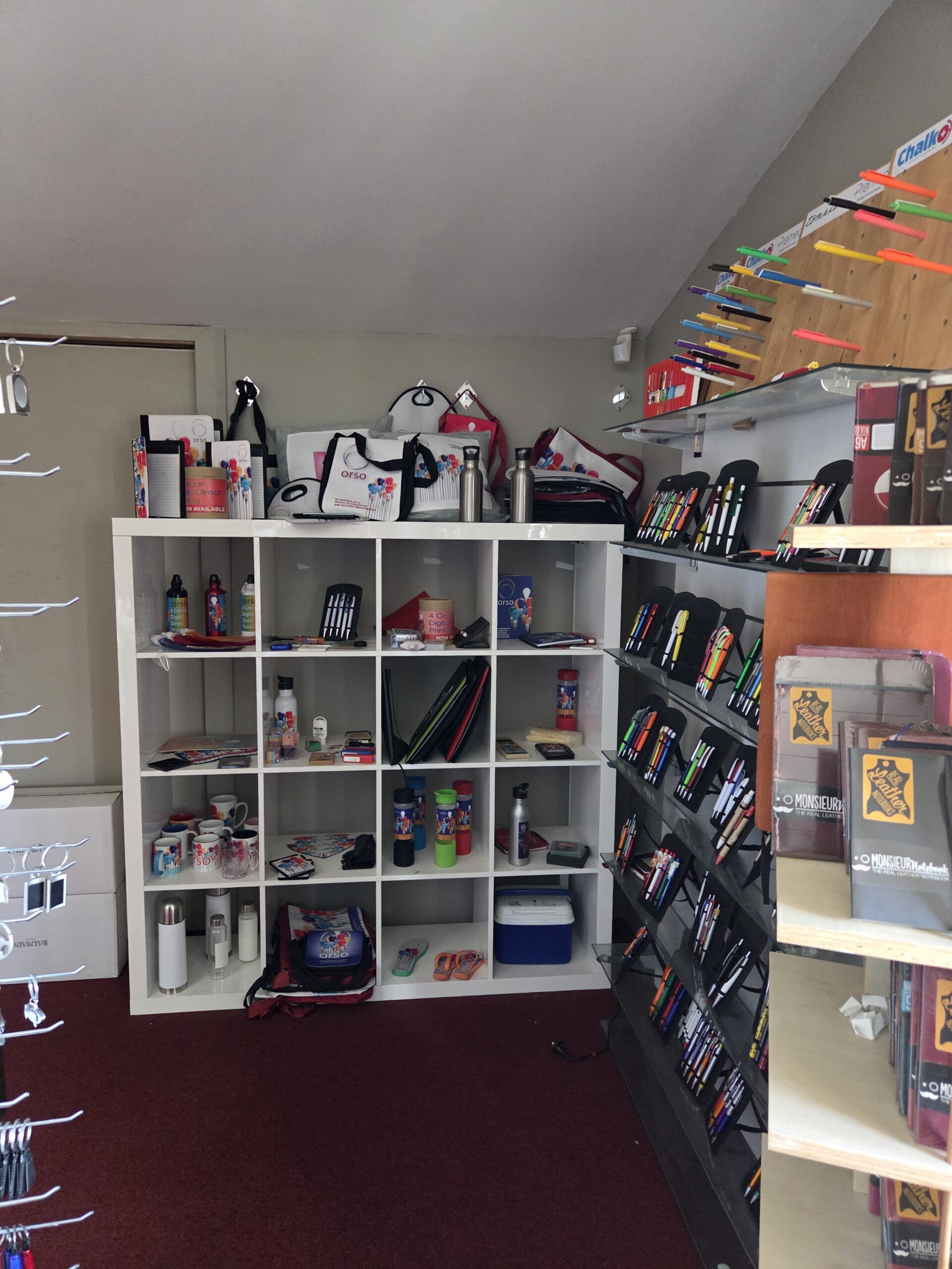 zoomed out view of promotional showroom displayed in a white cabinet