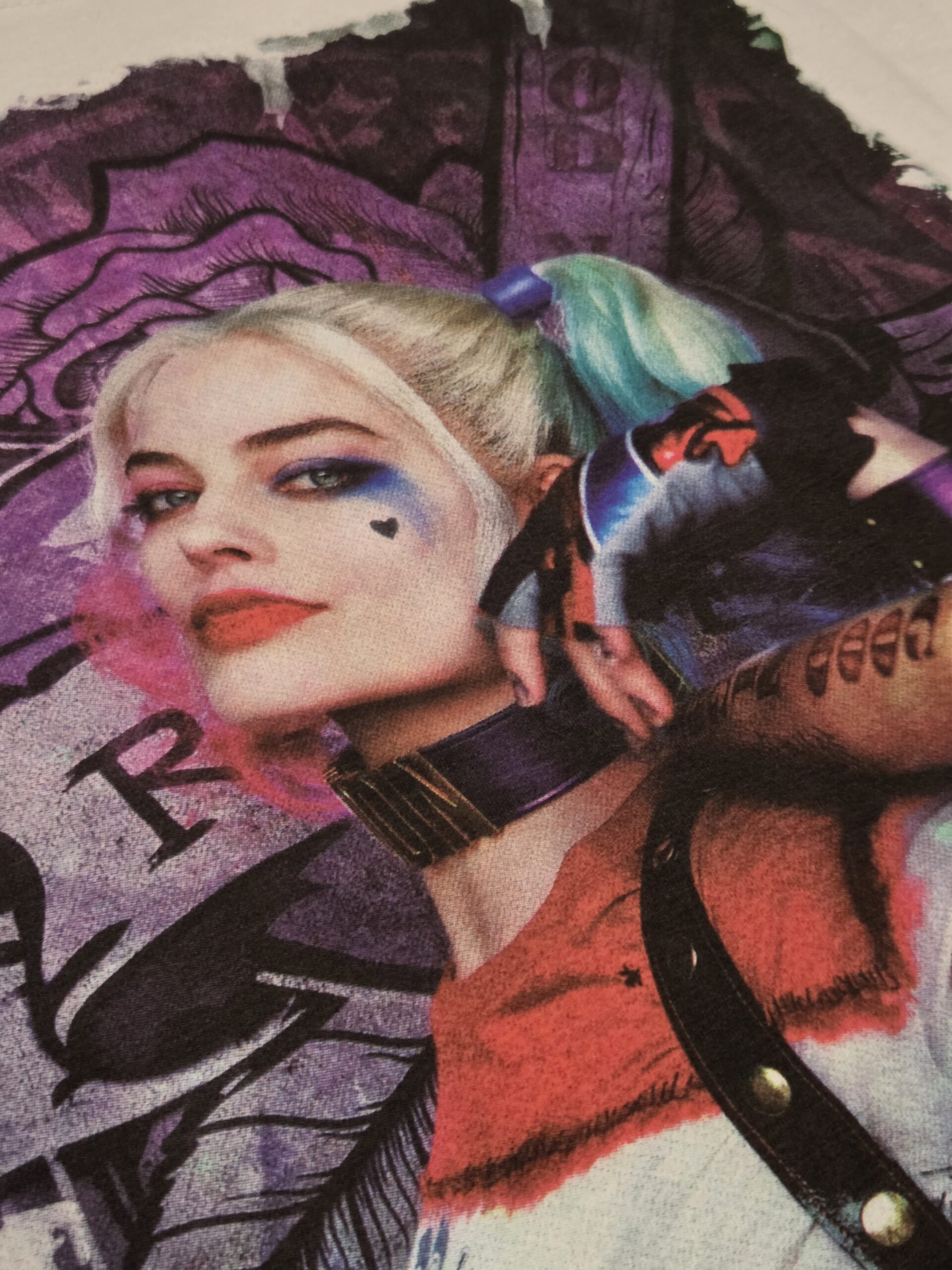 A woman with colorful hair and face paint poses confidently, digital print close up on tee shirt