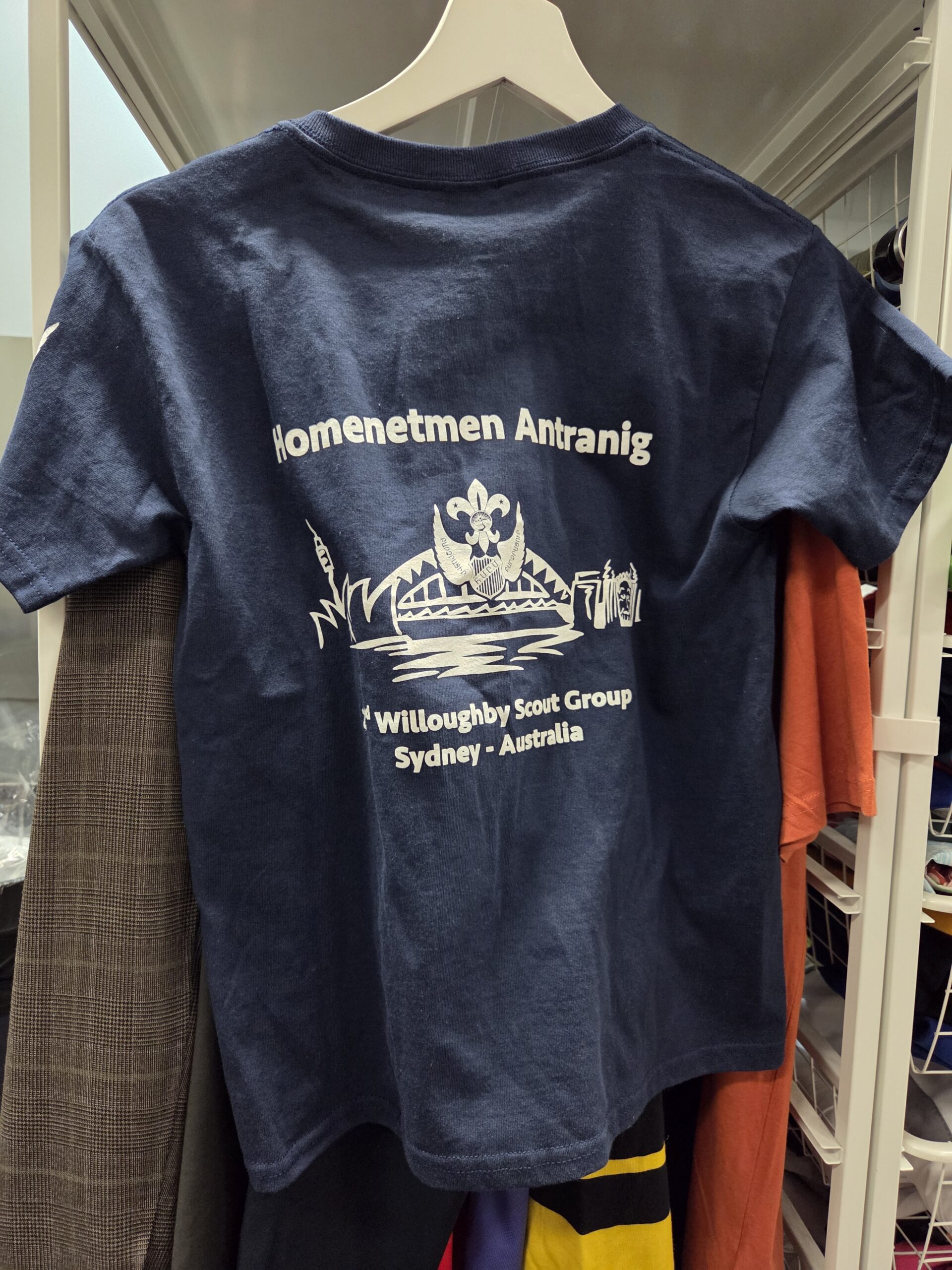 Navy blue t-shirt with scout logo, text, and vibrant screen printing for lasting quality.