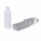A plastic water bottle next to a gray portable pet water dispenser.