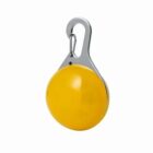 A yellow round keychain with a metal hook attached at the top.
