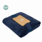 Folded navy blue blanket with a brown label and 240 GSM text in the corner.