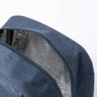 Blue insulated bag with a zipper, partially open to show the shiny silver interior lining.