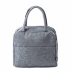 Gray fabric handbag with two handles, featuring a front pocket and simple, modern design.