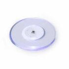 Round, transparent touch light with an on/off switch in the center, on a white background.