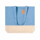 Blue and beige tote bag with long handles and a brown tag attached near the top.