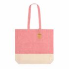 Pink and beige tote bag with long handles and a brown tag attached near the top.