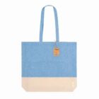 Blue and beige tote bag with long handles and a small brown tag attached.