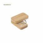 Two rectangular bamboo magnets, one slightly lifted, showing four round magnets inside.