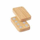 Two wooden dominoes, one showing six dots and the other showing five dots.
