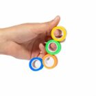 A hand holding four rolls of colorful tape: blue, orange, green, and yellow.
