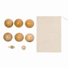 Seven wooden balls, one small peg, and a beige drawstring bag on a white background.