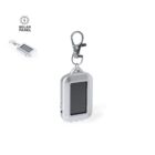 Small solar-powered keychain flashlight with a metal clip, shown on a white background.