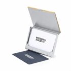 Open metal business card holder with MODERN SOLID cards inside and one card in front.