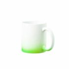 White mug with a green gradient at the bottom, placed on a plain white background.