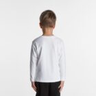Young boy in a white long-sleeve shirt and black pants standing with his back to the camera.