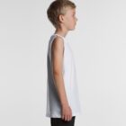 Young boy in a sleeveless white shirt, standing in profile against a plain light background.