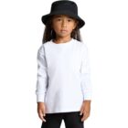 Child wearing a white long-sleeve shirt and black bucket hat, standing against a plain background.