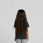 Child with long, wavy brown hair, wearing a black shirt, facing away from the camera.