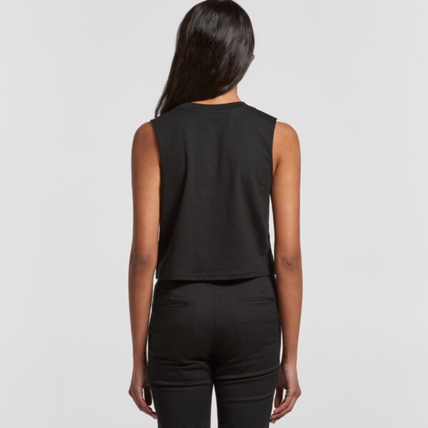 Person wearing a sleeveless black top and pants, shown from the back against a plain background.