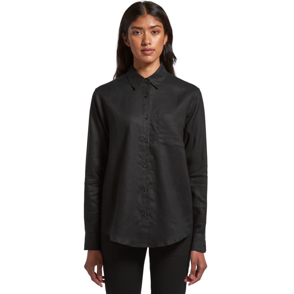 Woman wearing a black button-up shirt, standing against a white background.