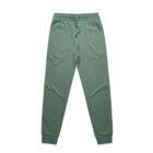 Green jogger sweatpants with an elastic waistband and cuffs, laid flat on a white background.