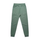 Green jogger sweatpants with an elastic waistband and cuffed ankles, laid flat.