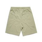 Light beige shorts seen from the back with an elastic waistband and a single back pocket.
