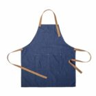 Blue denim apron with brown straps and front pockets, laid flat on a white background.