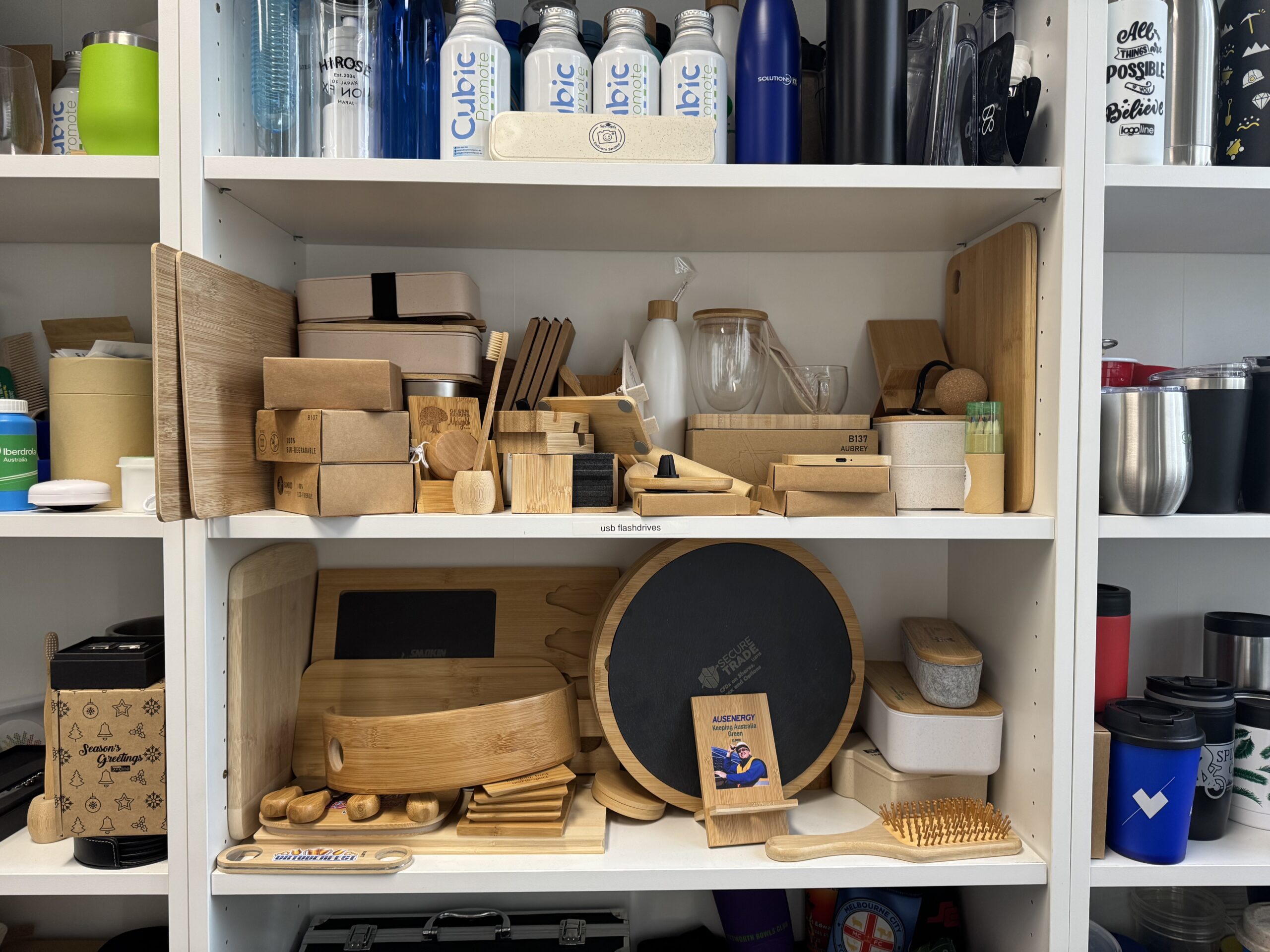 Shelves filled with Factory Direct bamboo kitchenware, boxes, and assorted household items.