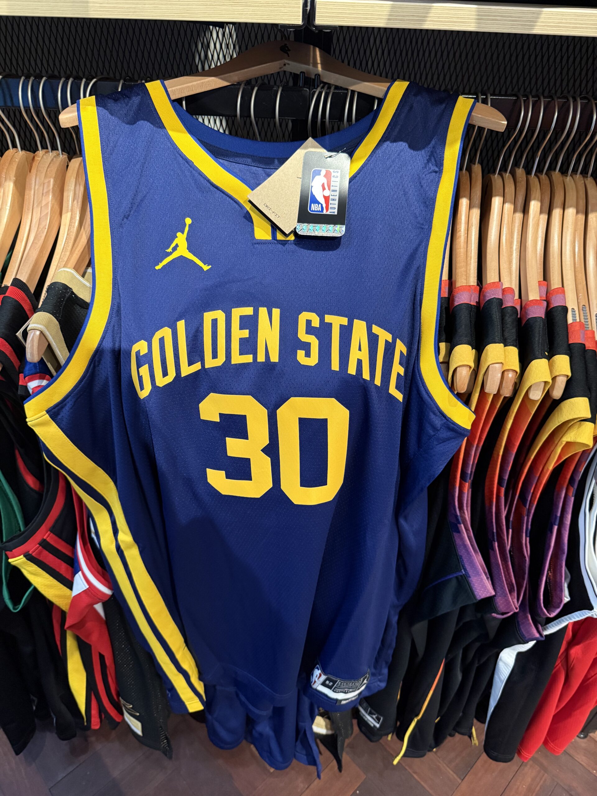 Blue Golden State custom jersey with yellow trim and number 30, inspired by Steph Curry.