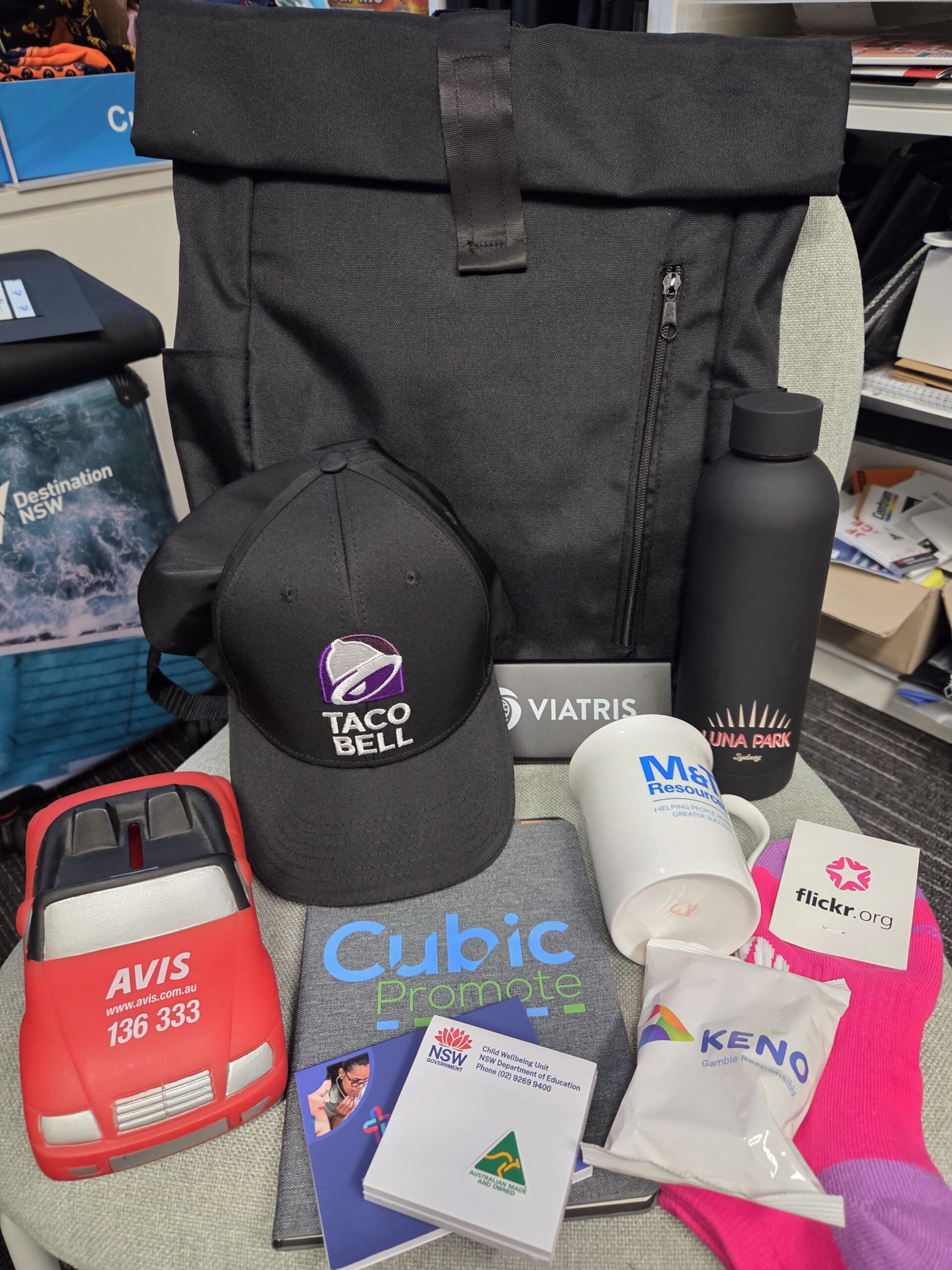 Assorted branded merchandise featuring May 2025’s Top 10 Promotional Products.