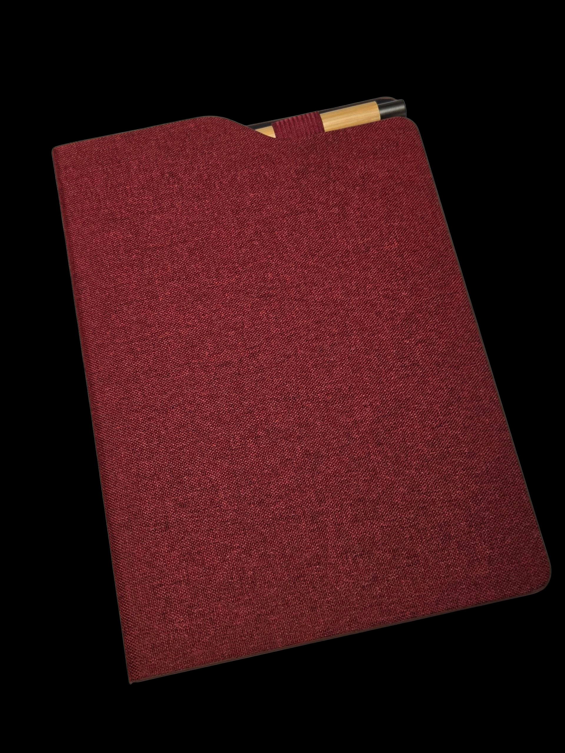 Red luxury merchandise folder with a pen tucked inside, set against a black background.