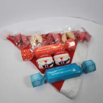 Santa hat with fortune cookies, Santa erasers, and a blue cracker—fun Promotional Xmas Gifts.