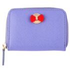 Purple wallet with a zipper and a gold button featuring a small red bow decoration.