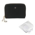 Black zippered wallet with gold accents and a white drawstring pouch beside it.