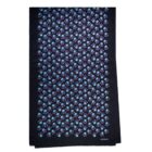 Black scarf with a blue floral pattern and a small cacharel logo in the corner.