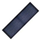 A black yoga mat with a pattern of small blue and purple flower-like shapes.