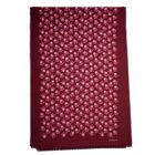 Maroon scarf with a pink floral pattern and small fringe on the bottom edge.