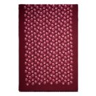 Maroon scarf with a pattern of small pink and red flowers, fringe at the bottom edge.
