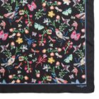A black scarf with colorful bird, butterfly, and flower patterns, bordered by a light blue edge.