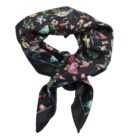 Black silk scarf with colorful floral and bird patterns, tied loosely in a knot.