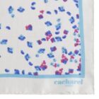 White fabric with scattered blue and pink spots, blue border, and cacharel PARIS text.