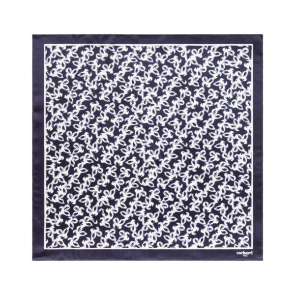Navy blue scarf with a white abstract pattern and a solid border.