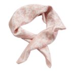 Light pink silk scarf with a subtle white pattern, loosely tied in a loop.