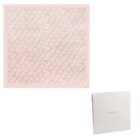 Light pink scarf with white floral pattern, displayed next to a white Cacharel box.