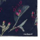 Navy blue scarf with floral and berry print, featuring the Cacharel logo in white.