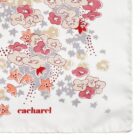 White scarf with red, pink, and beige floral patterns and the word cacharel in red.