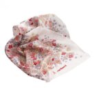 Crumpled floral-patterned white scarf with red, pink, and beige designs and cacharel text.