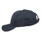 Black baseball cap with a curved brim, shown from the side on a white background.